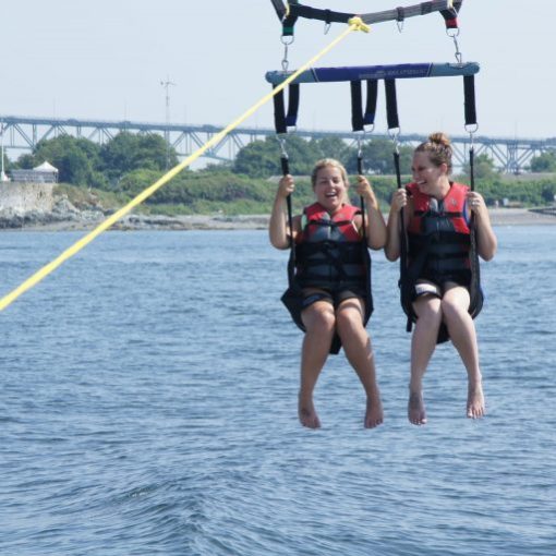 a group of people in a boat on a body of water